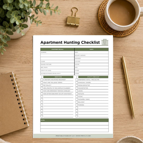 An Apartment Hunting Checklist printable sheet displayed on a wooden desk flat-lay with a coffee cup, gold binder clip, pen, and notebook.