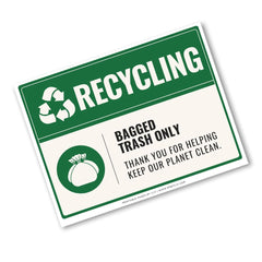 A square recycling sign with a green and white design, featuring the word 'RECYCLING' in large white letters on a green background, a recycling symbol, and text that reads 'BAGGED TRASH ONLY' and 'THANK YOU FOR HELPING KEEP OUR PLANET CLEAN.'.