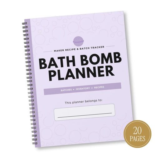 A spiral-bound Bath Bomb Planner with a light lavender cover, black metal wire binding, and bold black text reading 'BATH BOMB PLANNER.' The cover also includes smaller text such as 'MAKER RECIPE & BATCH TRACKER' and a blank line for writing, plus a round gold badge in the lower right that says '20 PAGES.