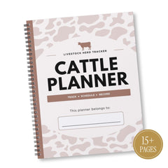 A spiral-bound Cattle Planner with a white cover decorated with a dusty pink cow print pattern. The cover features a brown silhouette of a cow, the text 'LIVESTOCK HERD TRACKER', and 'CATTLE PLANNER' in bold black letters.