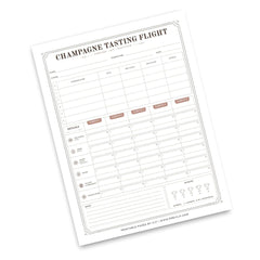 A single printed sheet titled "Champagne Tasting Flight" shown at an angle on a white background. The page contains structured tables for wine and champagne evaluation, with labeled columns and small decorative border lines.