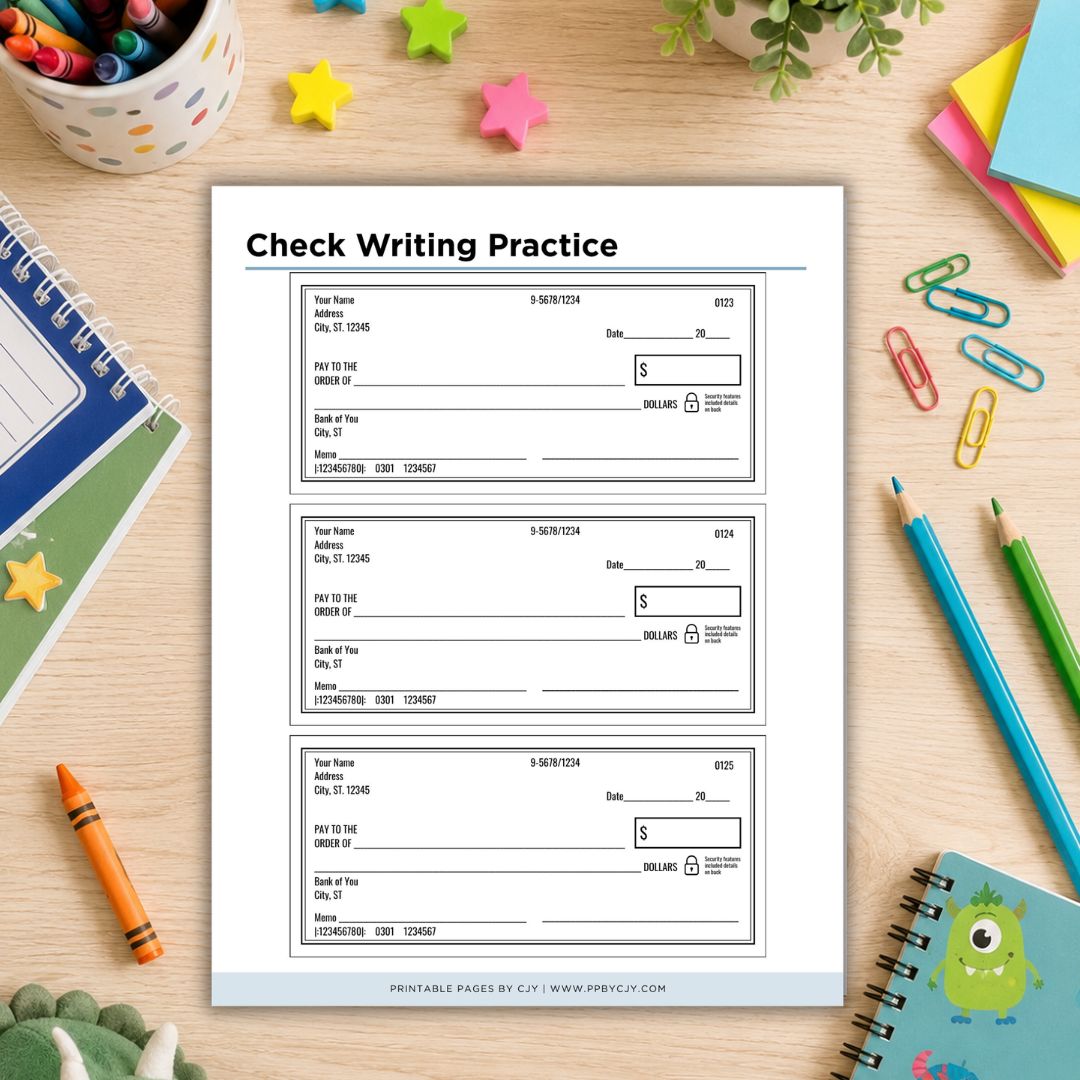 A sheet of printable check writing practice pages displayed on a wooden desk surrounded by school supplies, including notebooks, pencils, paper clips, a crayon, and star stickers.
