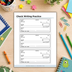 A sheet of printable check writing practice pages displayed on a wooden desk surrounded by school supplies, including notebooks, pencils, paper clips, a crayon, and star stickers.