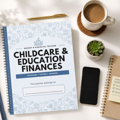 A spiral-bound budget and financial tracker planner titled 'Childcare & Education Finances' is shown in a styled flat-lay on a white surface, surrounded by a coffee cup, a small succulent, a smartphone, and other notebooks.