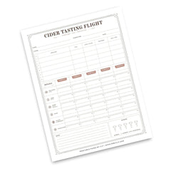 A printable 'Cider Tasting Flight' log sheet shown at an angle on a white background. The form has columns for date, temperature, oxygen, carbon dioxide, and clarity, with sections for notes and ratings, plus a small brand footer reading 'Printable Passes by Cut | www.