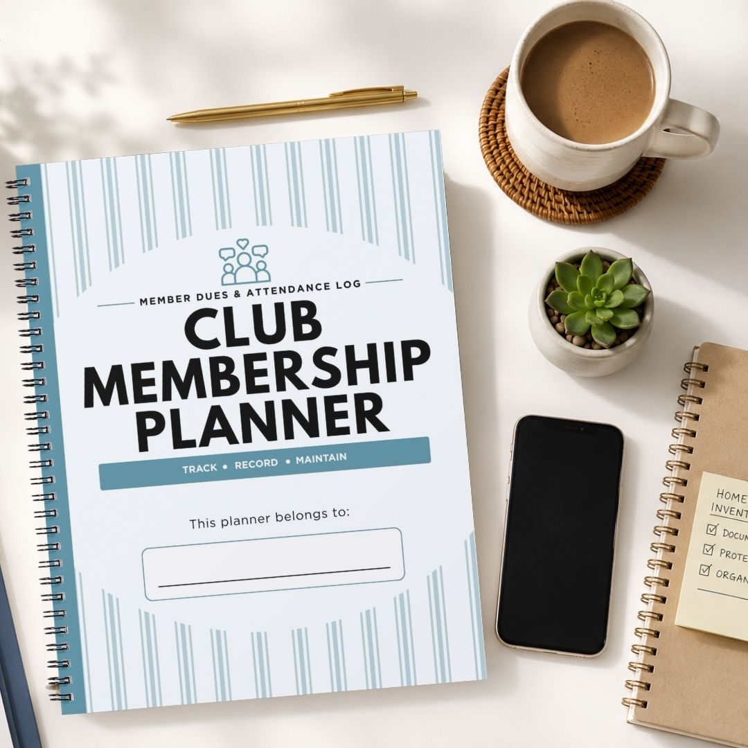 A spiral-bound Club Membership Planner notebook with a white cover and light blue vertical stripes, styled in a flat-lay arrangement on a white desk alongside a cup of coffee, a pen, a small succulent, a smartphone, and another notebook.