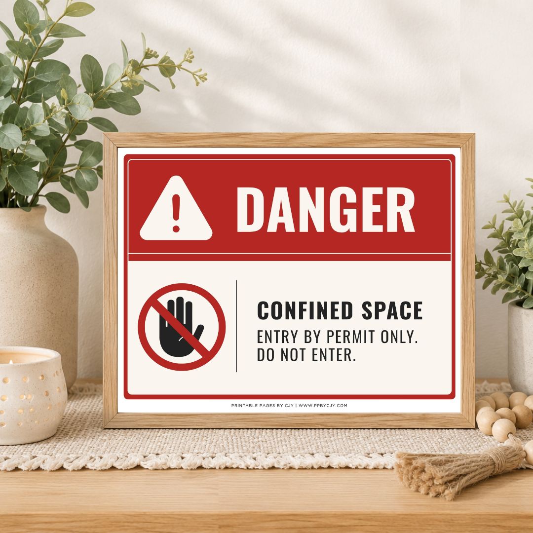 A framed warning sign with a red and white background reading “DANGER” and “CONFINED SPACE ENTRY BY PERMIT ONLY. DO NOT ENTER.
