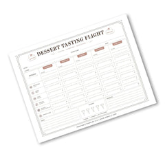 A printable dessert tasting flight chart template shown at an angle on a white background. The sheet features columns for date, time, temperature, and notes, with sections for dessert categories and rating fields.