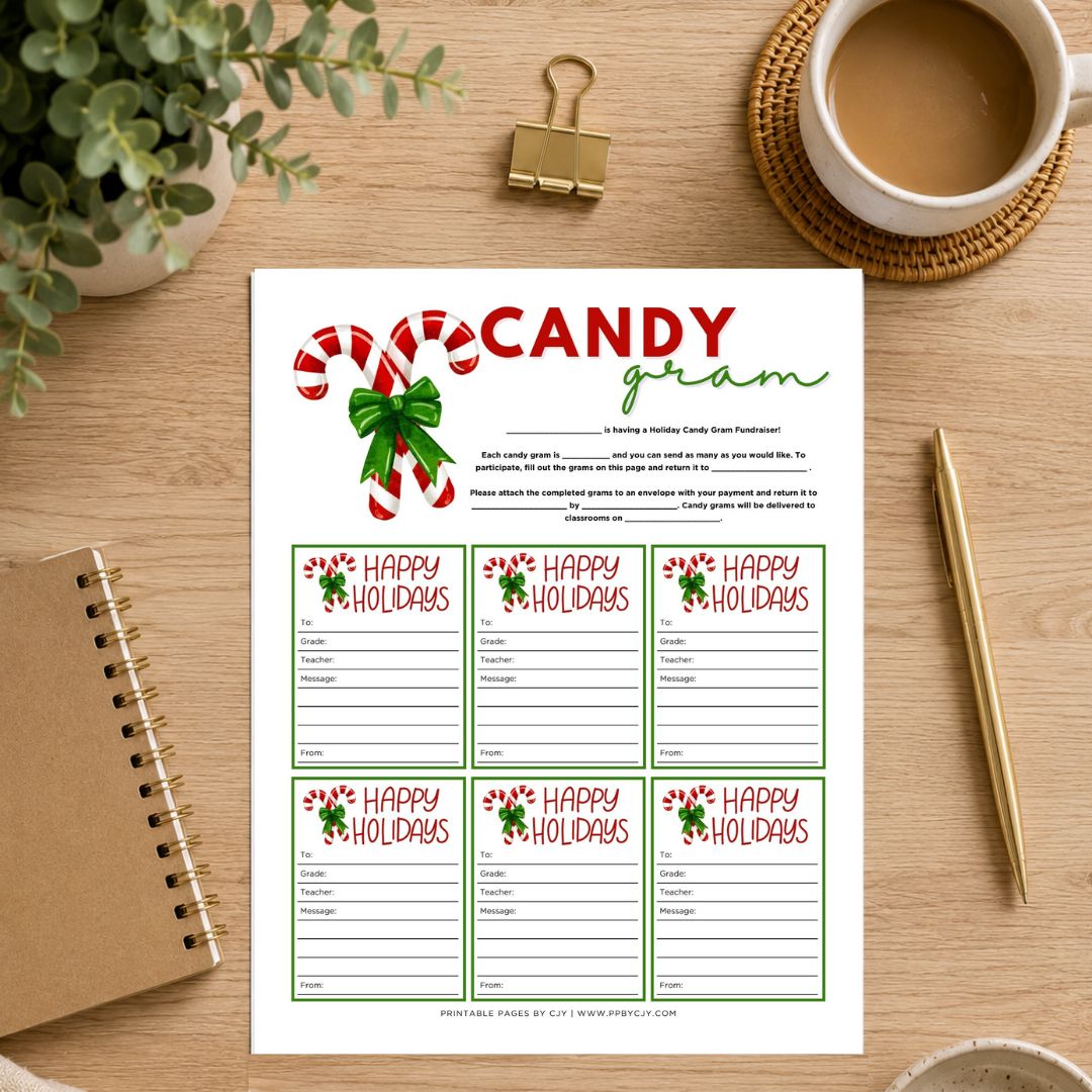 A printable holiday game sheet titled 'CANDY gram' with six 'Happy Holidays' cards, styled on a wooden desk with a coffee cup, plant, notebook, and gold pen.