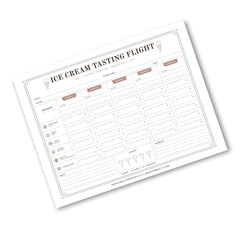 An 'Ice Cream Tasting Flight' printable tracking sheet shown at an angle on a white background. The sheet features columns for flight number, date, temperature, and ratings for flavors like vanilla, chocolate, and strawberry, with a clean minimalist design.