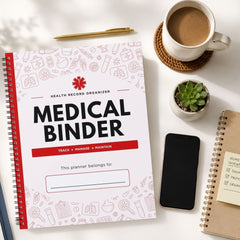 A spiral-bound medical record organizer planner titled 'MEDICAL BINDER' is shown in a styled flat-lay on a white surface, surrounded by a coffee cup, pen, small plant, smartphone, and another notebook.