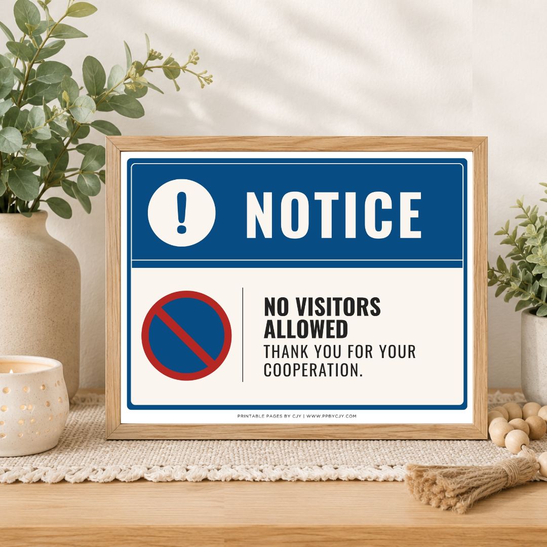 A framed novelty sign with a blue and white design that reads 'NOTICE' and 'NO VISITORS ALLOWED THANK YOU FOR YOUR COOPERATION.' The sign is displayed on a wooden table with decorative plants, a candle, and a burlap bundle in a styled indoor setting.