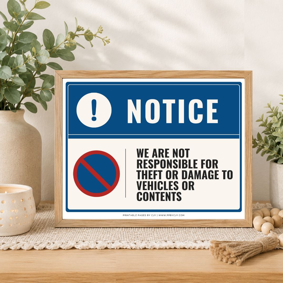 A framed warning sign displayed on a wooden table in a styled home setting. The sign features a blue header with a white exclamation mark and the word 'NOTICE', and a white lower section with black text reading 'WE ARE NOT RESPONSIBLE FOR THEFT OR DAMAGE TO VEHICLES OR CONTENTS' alongside a red and blue prohibition symbol.