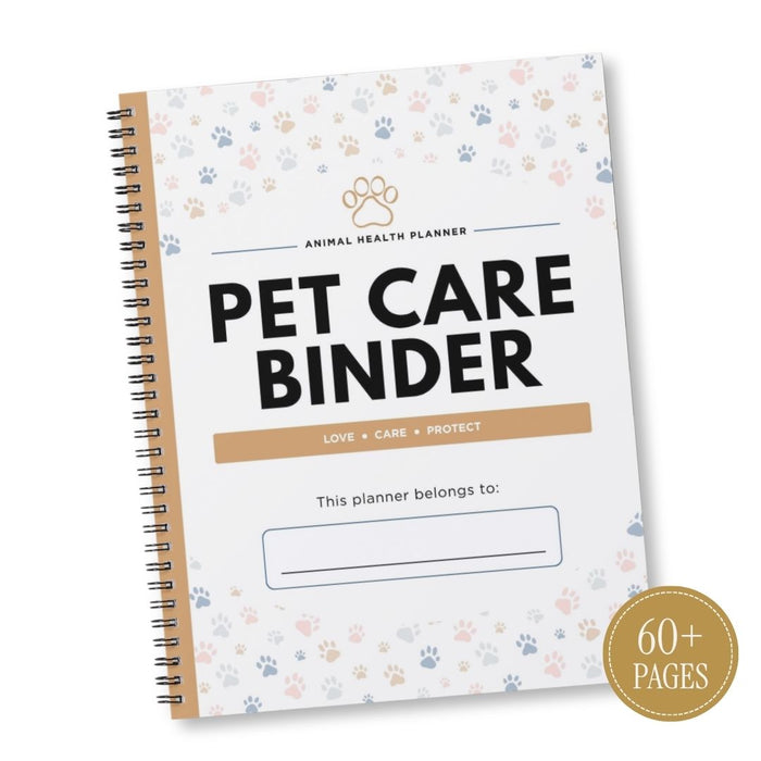 A spiral-bound Pet Care Binder planner shown at an angle on a white background. The cover is white with a pattern of small paw prints in pastel blue, pink, and beige, featuring the title 'PET CARE BINDER' in bold black letters.