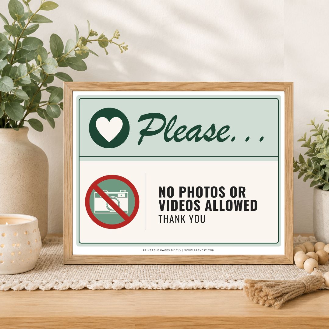 A framed printed sign on a tabletop in a styled interior setting. The sign reads 'Please.