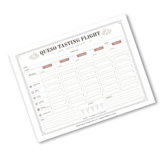 A printable cheese tasting flight chart template shown at an angle on a white background. The sheet features a clean, minimalist design with columns for date, temperature, texture, flavor, and notes, along with sections for scores and awards.
