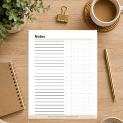 A printable notes page with lined writing space and a dotted grid, styled on a wooden desk with a spiral notebook, plant, coffee cup, binder clip, pen, and coaster.