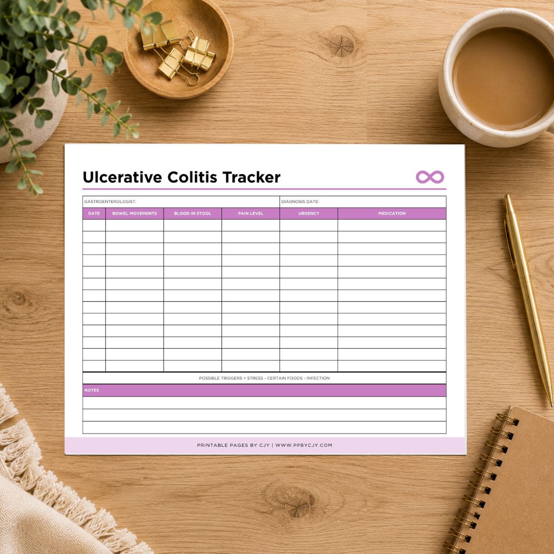 A printableInterstitial Cystitis Tracker sheet displayed on a wooden desk with a coffee cup, plant, gold clips, pen, and notebook around it. The tracker has columns for date, urine color, frequency, urgency, symptoms, and notes, with purple headers and a purple infinity symbol.