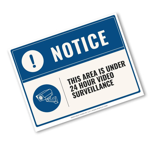 A rectangular security notice sign with a blue header and white body, reading 'NOTICE' and 'THIS AREA IS UNDER 24 HOUR VIDEO SURVEILLANCE,' with a camera icon and small 'Printable Pages by LIZ www.practical.