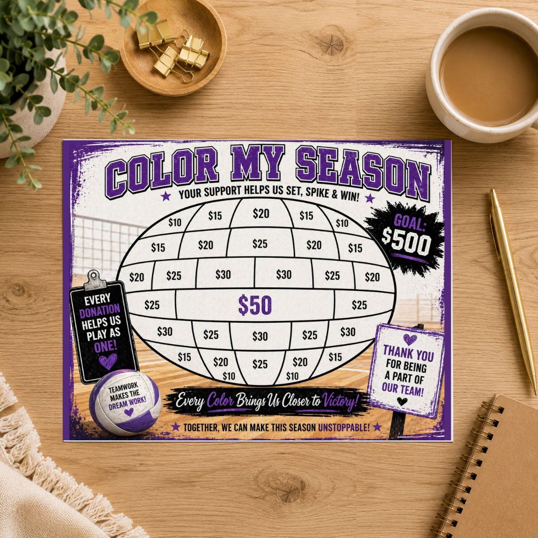 A square printed game board titled "COLOR MY SEASON" with purple, white, and black graphics, placed on a wooden tabletop with a coffee cup, plant, notebook, and small decor items around it.