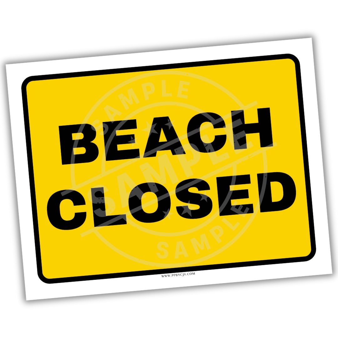 Yellow 'Beach Closed' sign with black text on a white background