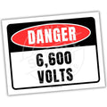 Danger - sign indicating 6,600 volts on a white background