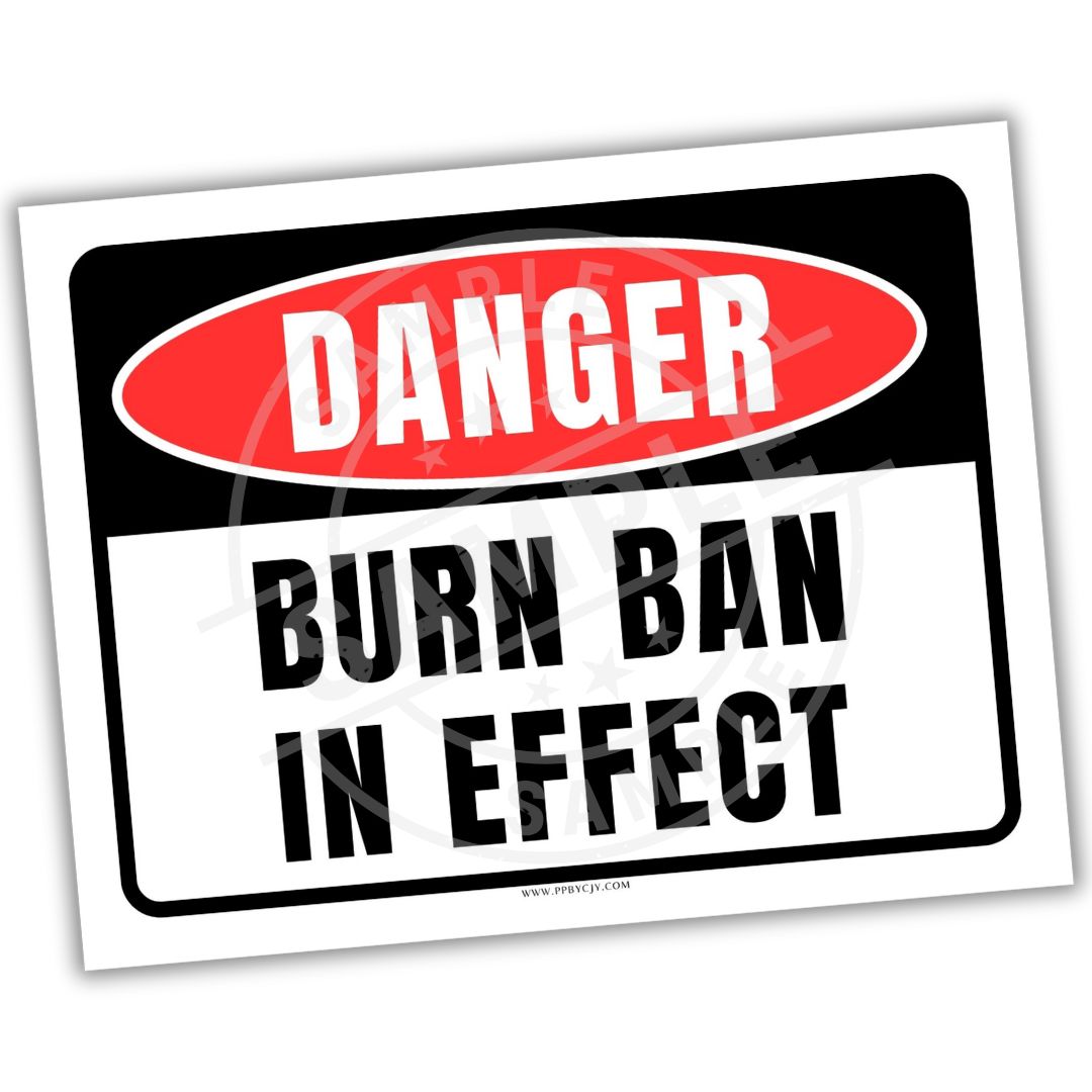 Warning sign with 'Danger: Burn Ban in Effect' text on a white background