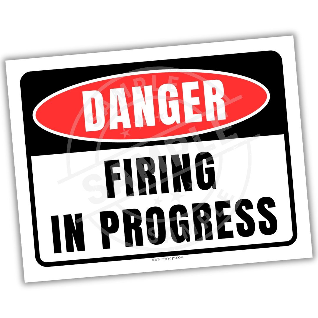 Sign with 'Danger: Firing in Progress' text on a white background