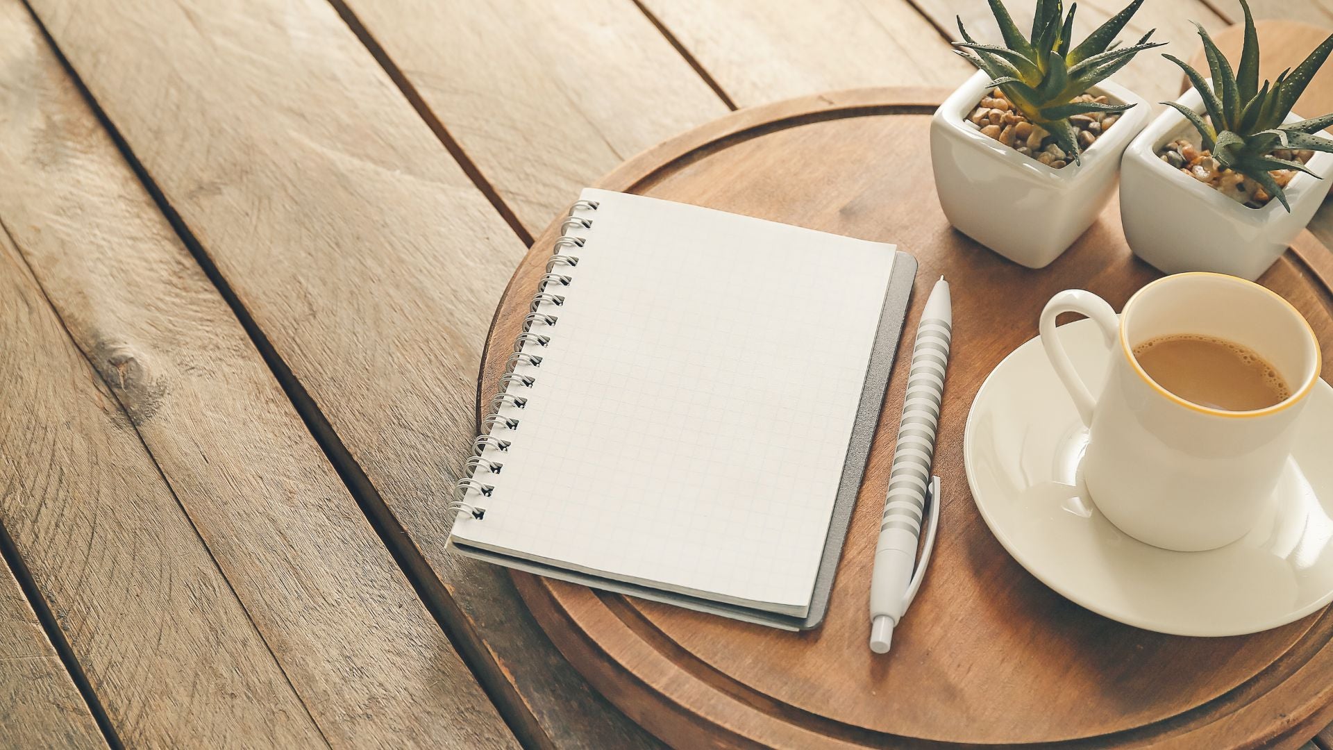Planner and notebook on a desk