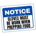 Safety sign with 'Notice: Gloves must be worn when prepping food' text on a white background