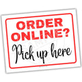 Sign with 'ORDER ONLINE? Pick up here' text on a white background