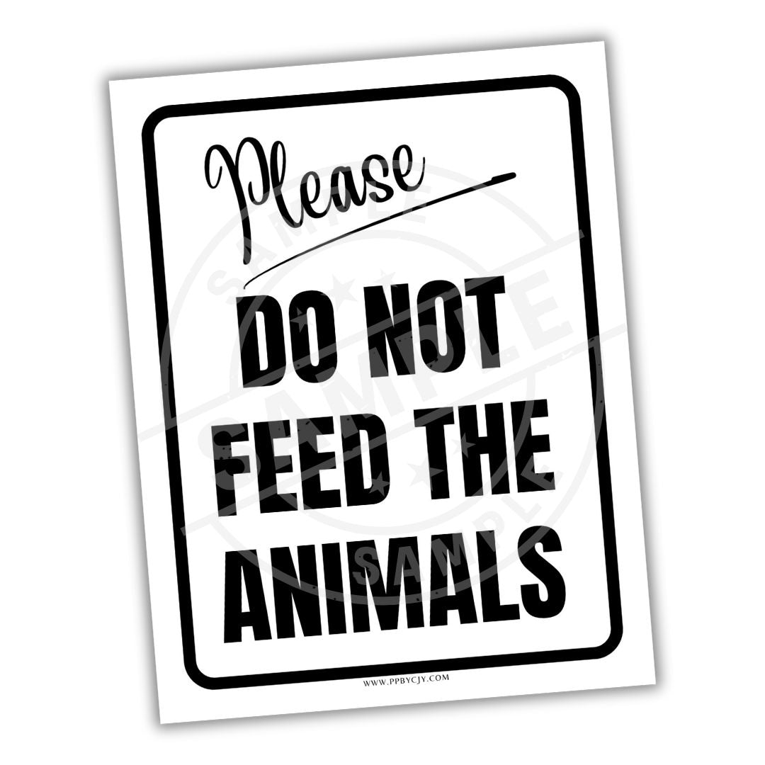 Sign that reads 'Please do not feed the animals' on a white background