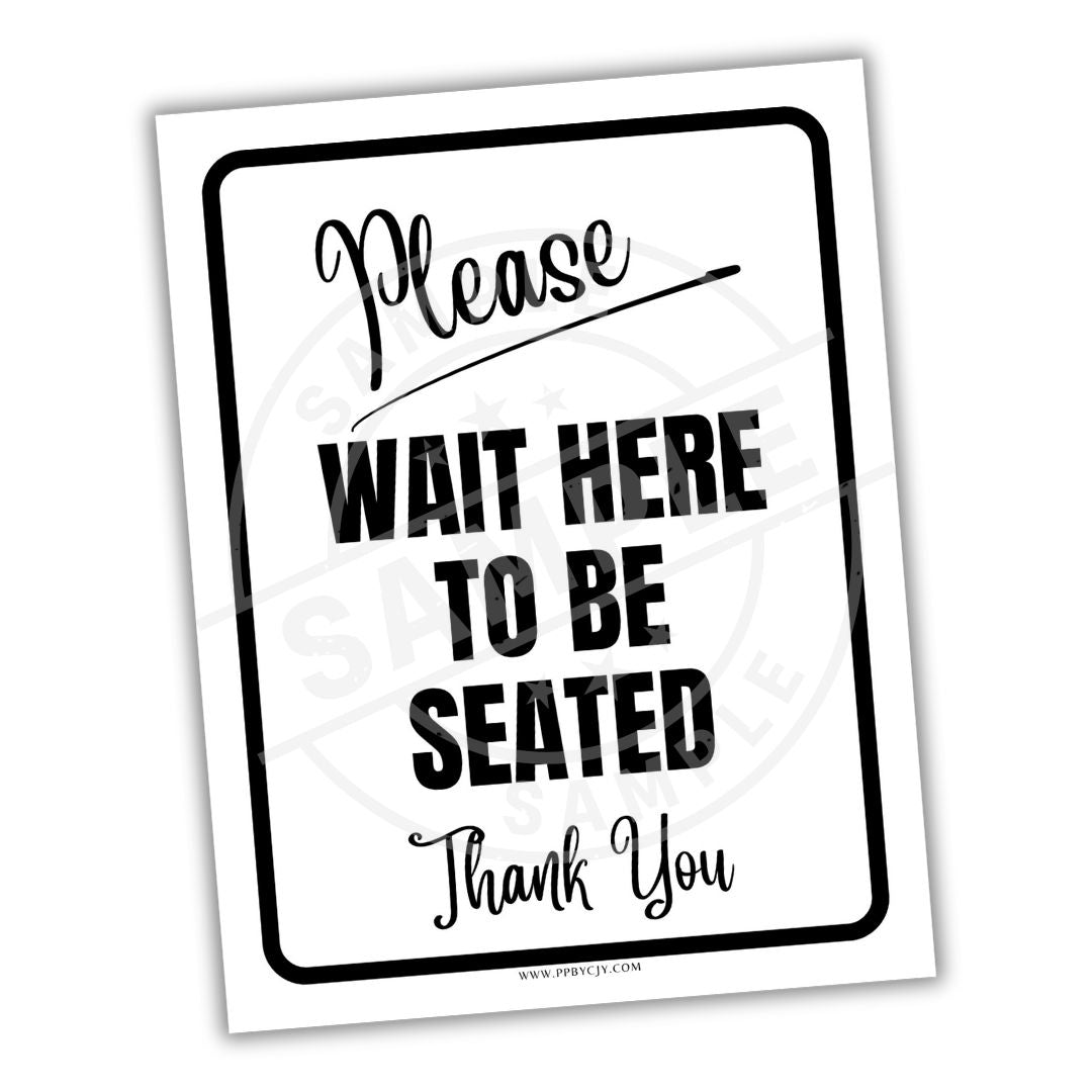White sign with black text 'Please Wait Here To Be Seated Thank You' on a white background