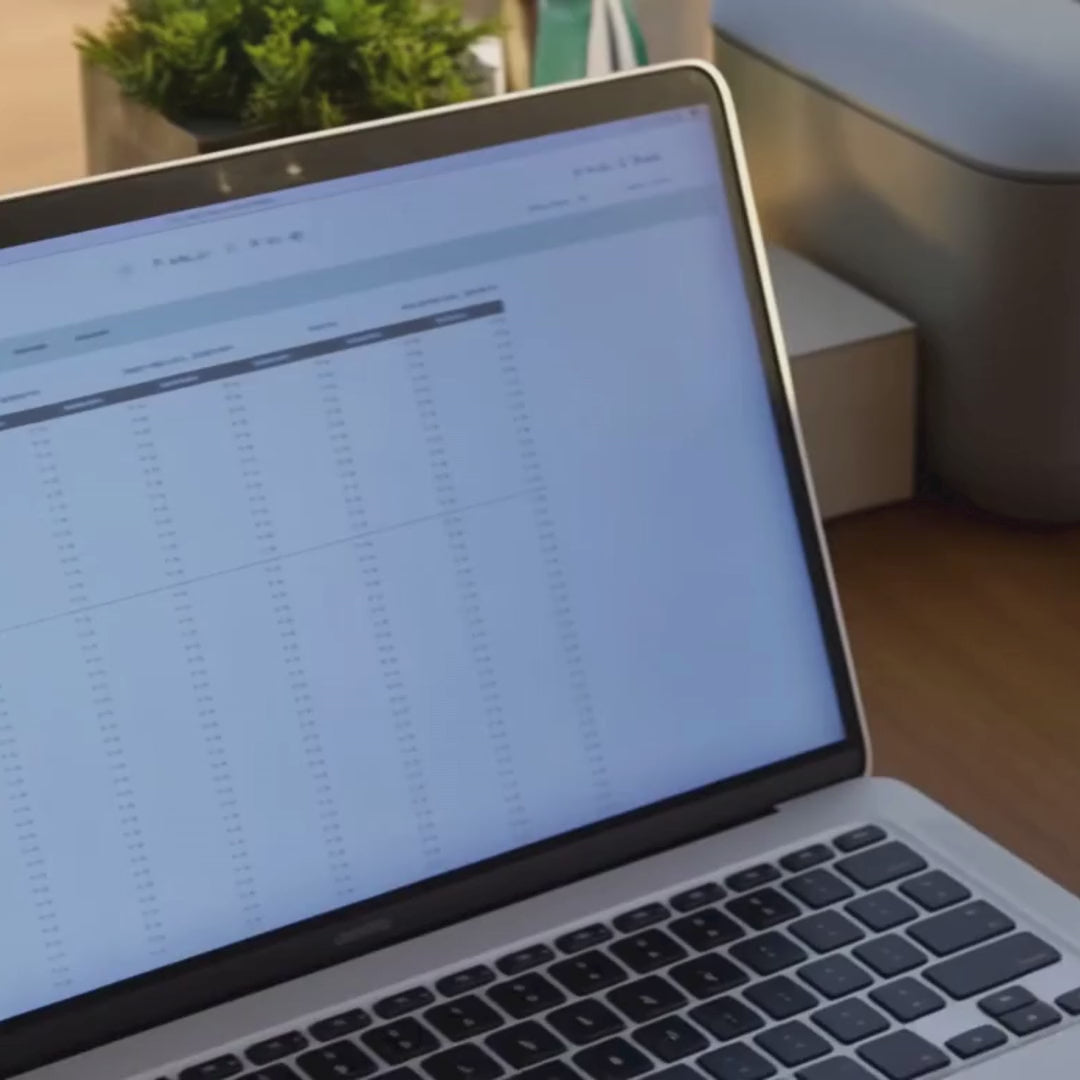 video of laptop, printer, and pages in a binder
