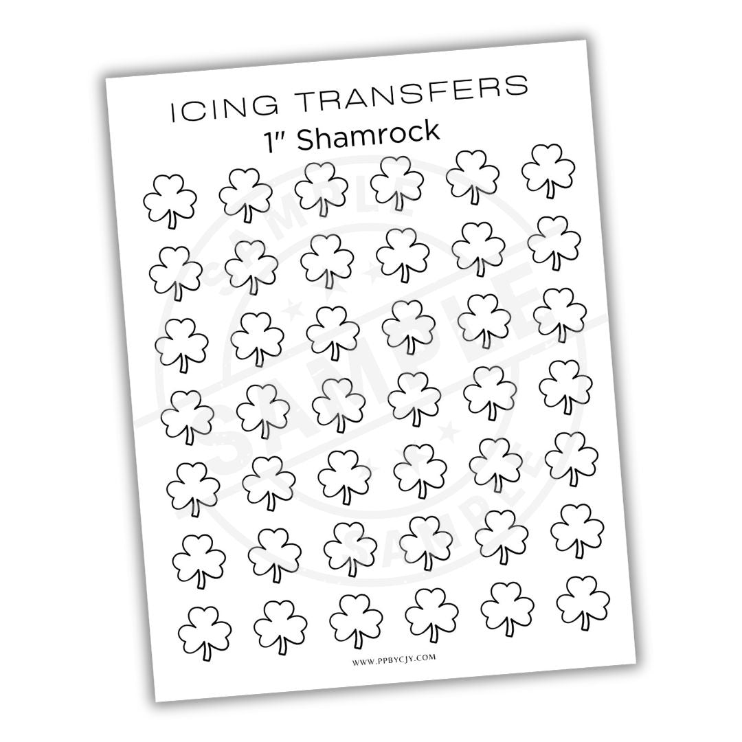 Sheet of shamrock-shaped icing transfers on a white background