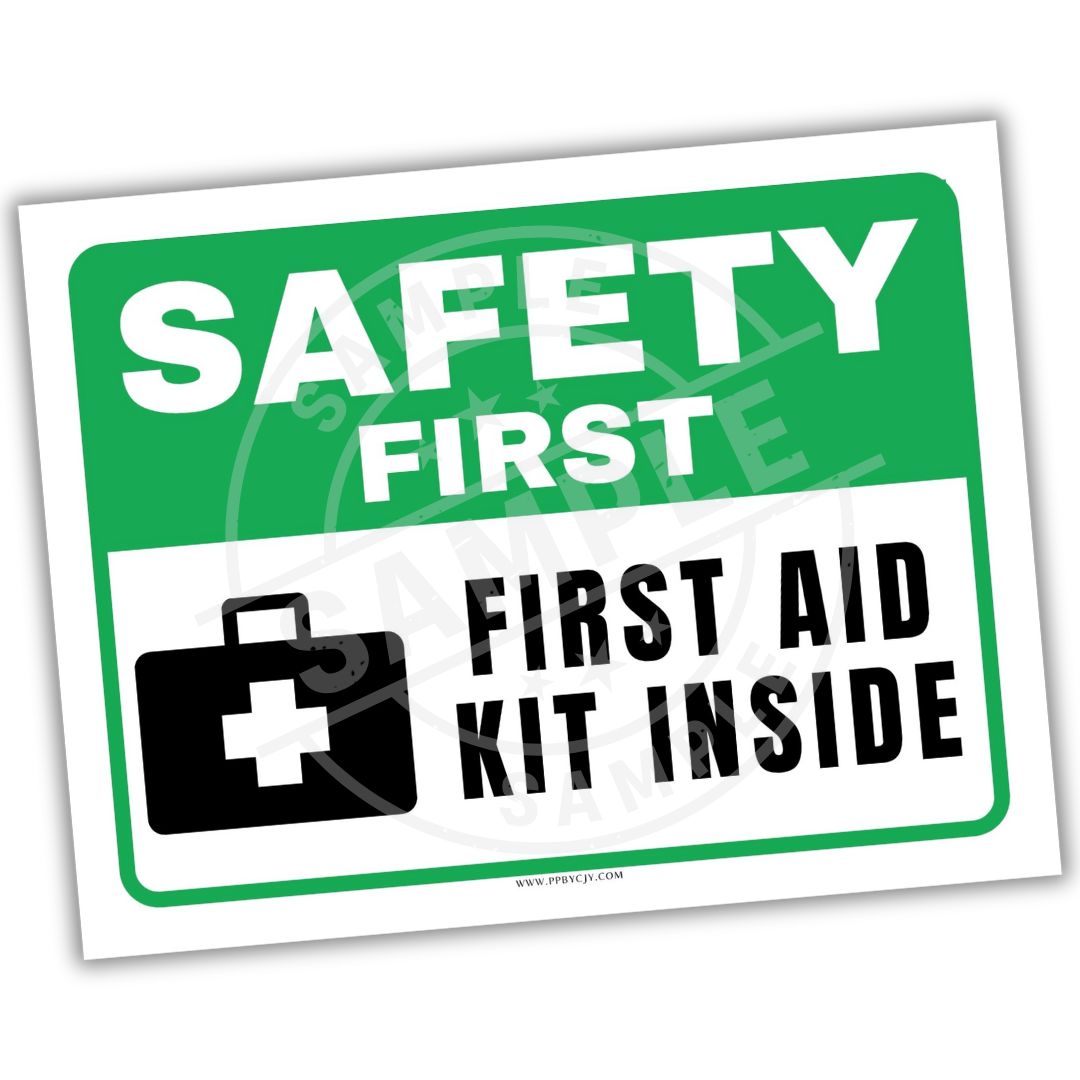 Safety sign with 'Safety First' and 'First Aid Kit Inside' text on a white background