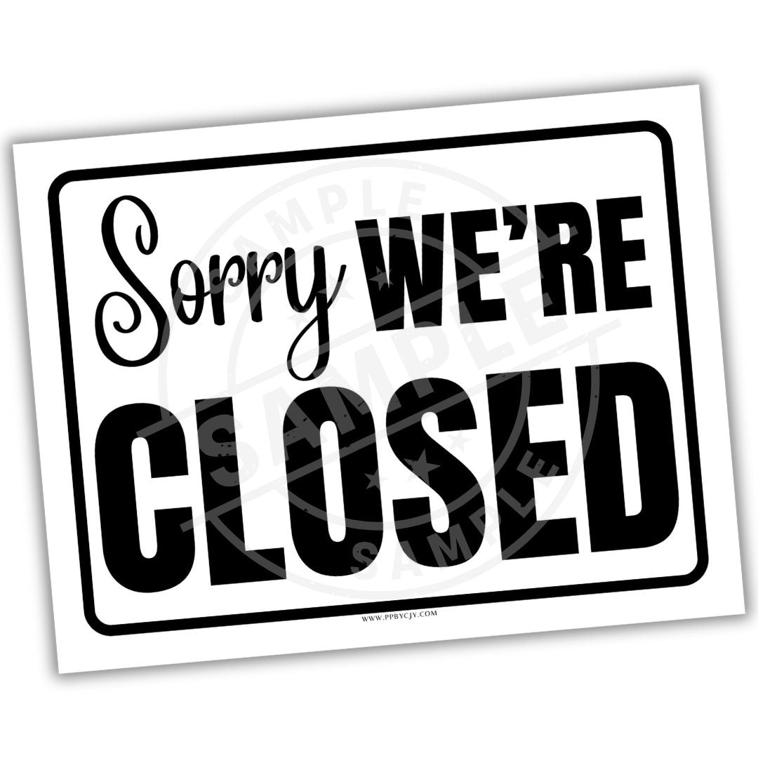 Sign with 'Sorry We're Closed' text on a white background